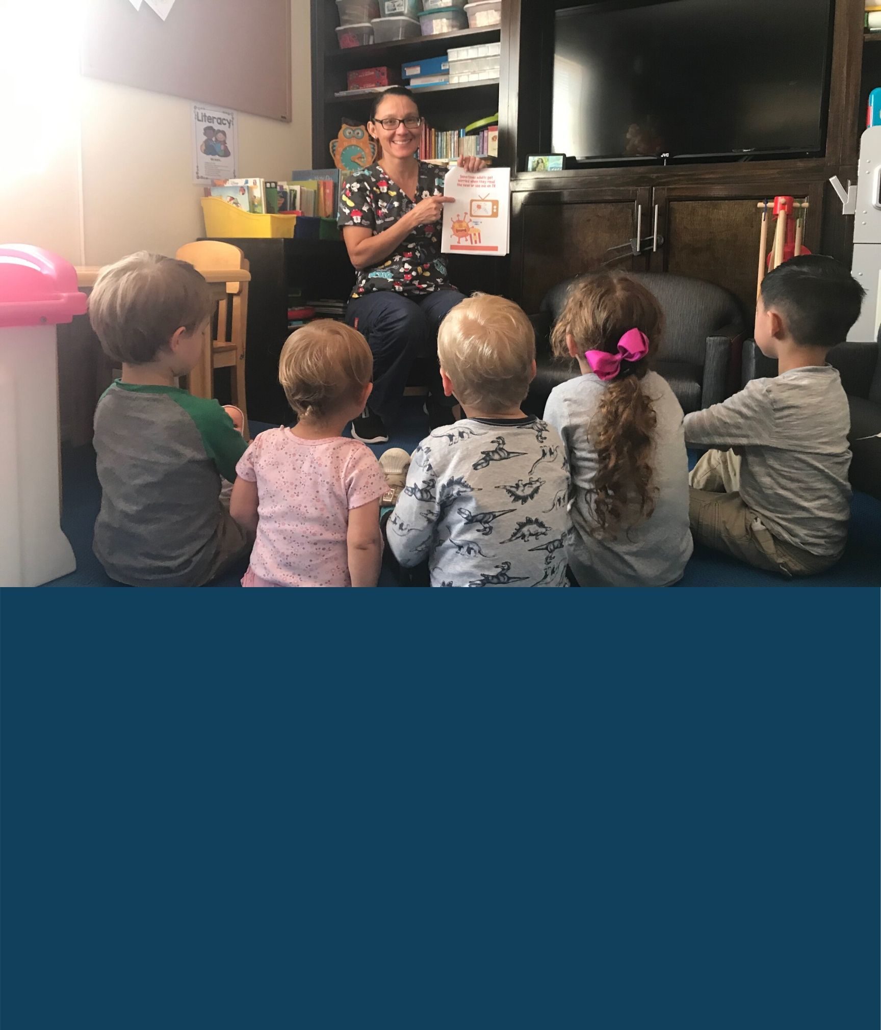 Childcare provider Mitzy Roque reads to a group of children